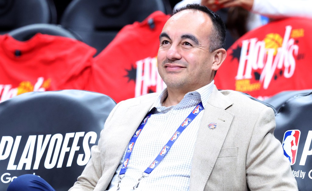 New York Knicks Senior Vice President of Basketball Operations Gersson Rosas sitting on the bench during an NBA Playoffs game.