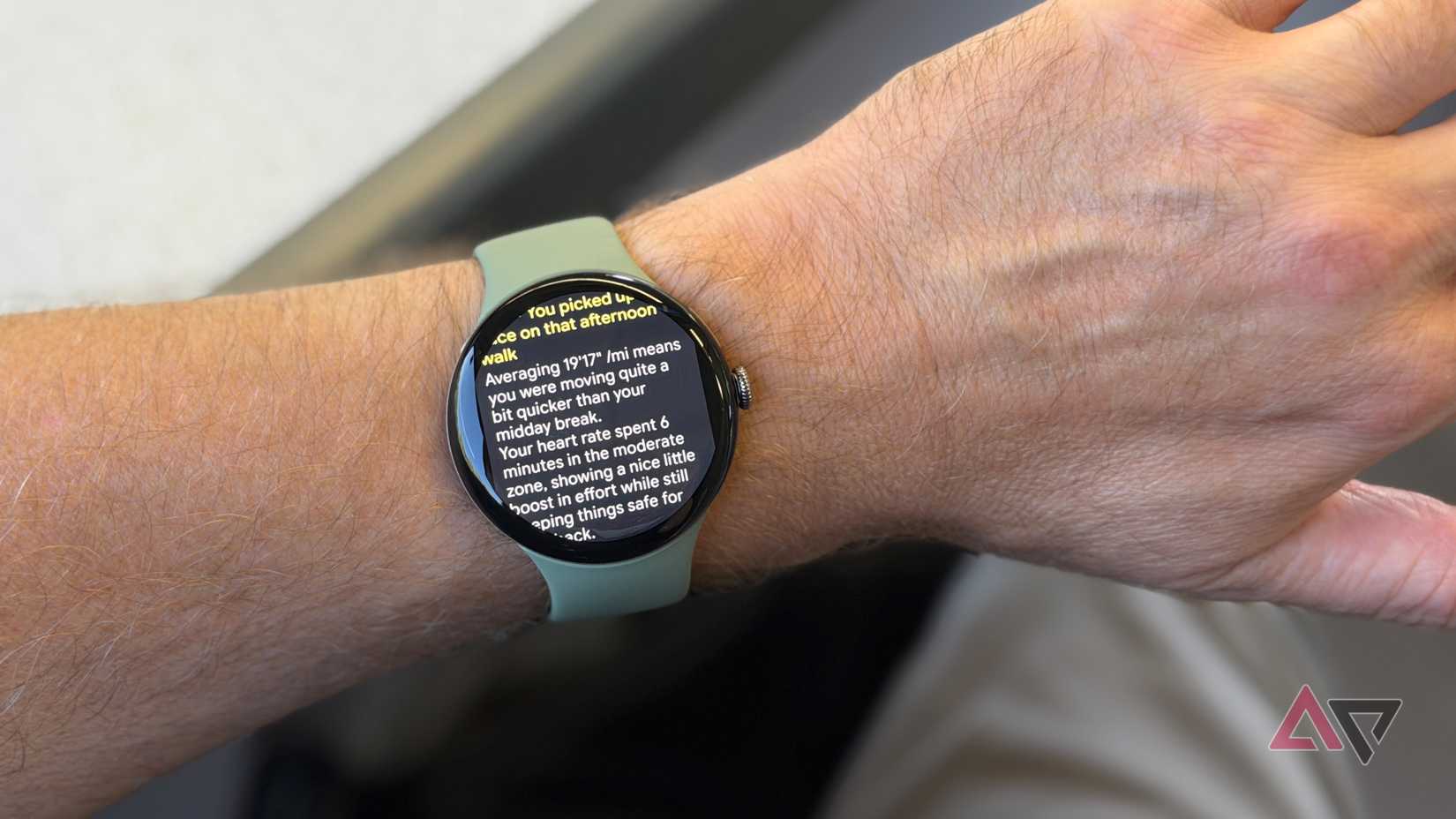 A person wearing the Google Pixel Watch 5, showing the morning report