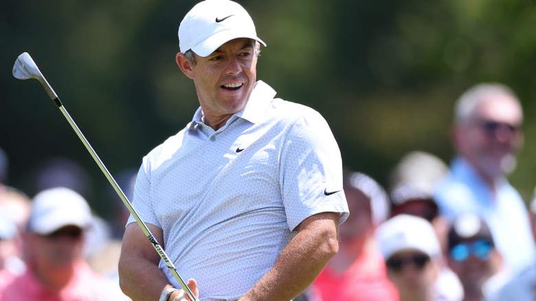 Rory McIlroy of Northern Ireland reacts after playing a shot onto the seventh green