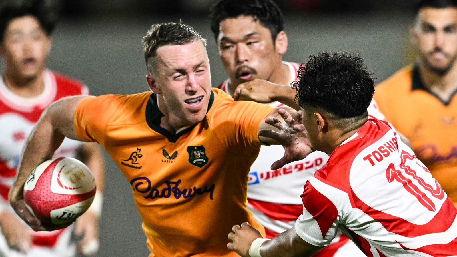 Harry Potter runs with the ball during Australia's win over Japan
