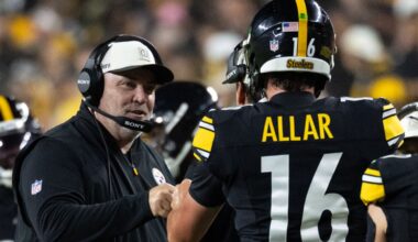 Pittsburgh Steelers head coach Mike McCarthy fist bumps quarterback Drew Allar during an NFL preseason game against Green Bay Packers
