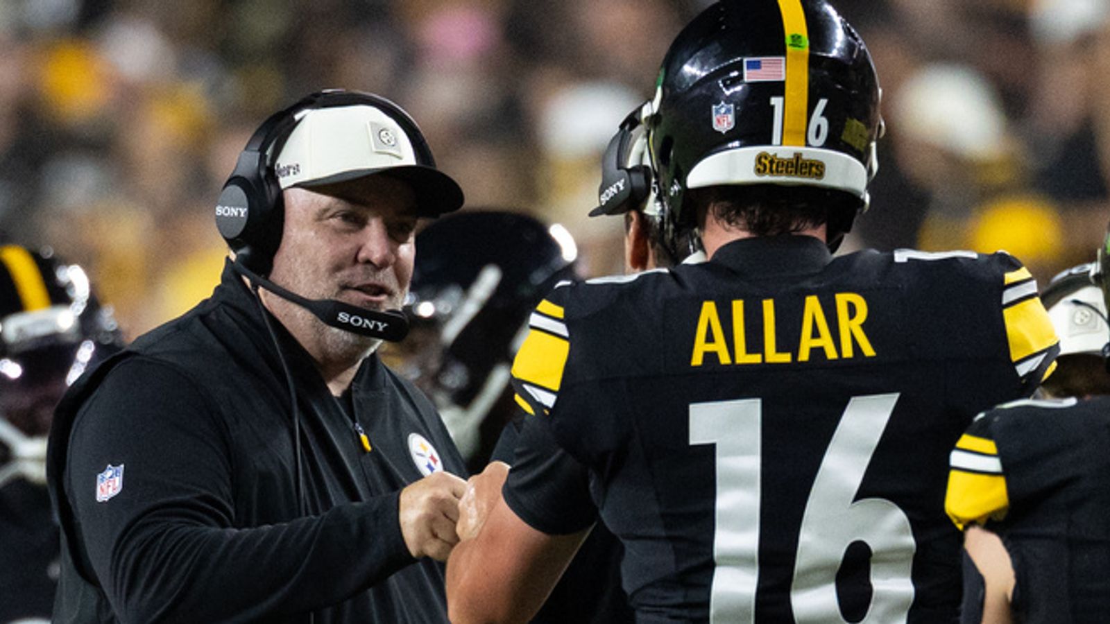 Pittsburgh Steelers head coach Mike McCarthy fist bumps quarterback Drew Allar during an NFL preseason game against Green Bay Packers