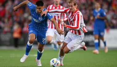 Brighton's Diego Gomez runs with the ball whilst under pressure from Tromso's Mathias Tonnessen