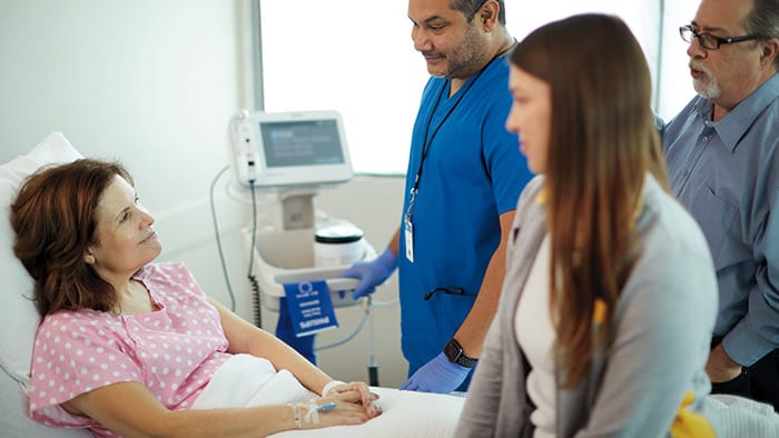 Female patient receiving care in hospital -