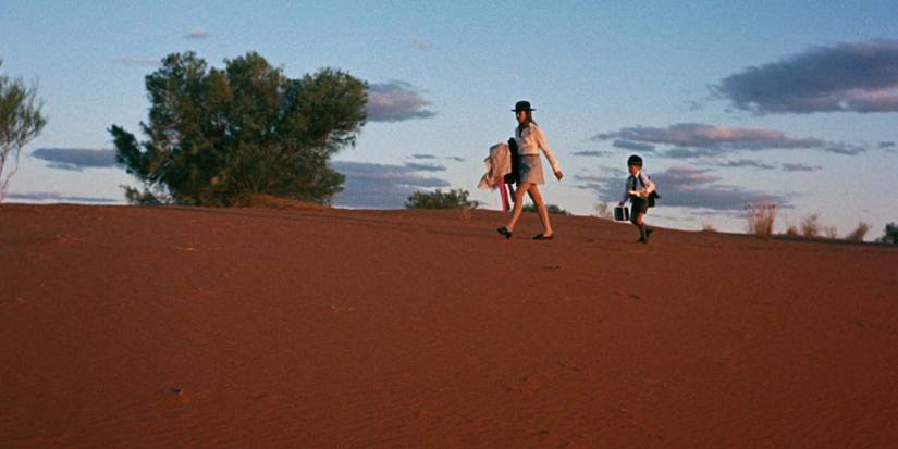 Jenny Agutter and Luc Roeg walk in the desert in 'Walkabout'