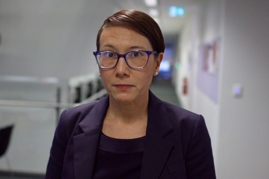 A woman wearing glasses.