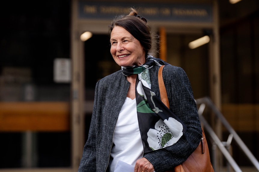 A woman pictured outside a courtroom building.