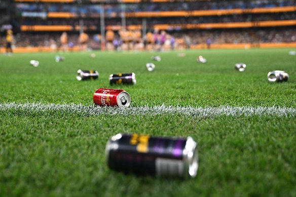 Cans and bottles on the ground at the MCG on Saturday night.
