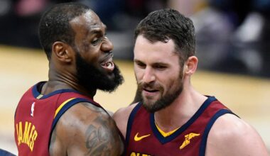Cleveland Cavaliers center Kevin Love (0) celebrates his three-point basket with forward LeBron James (23) in the fourth quarter against the Toronto Raptors at Quicken Loans Arena.