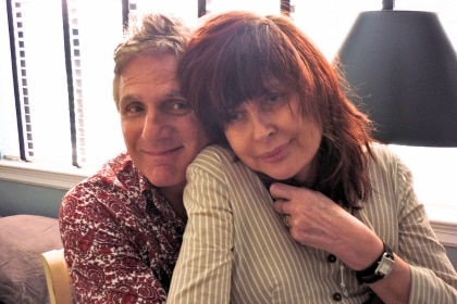 Chrissy Amphlett looks unwell sitting close by friend and band mate Rick Grossman