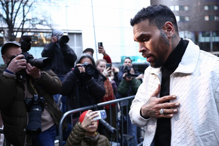Brown arrives at the Southwark Crown Court in London on January 28, after pleading not guilty in July 2025 on further charges stemming from an alleged London nightclub brawl in 2023.