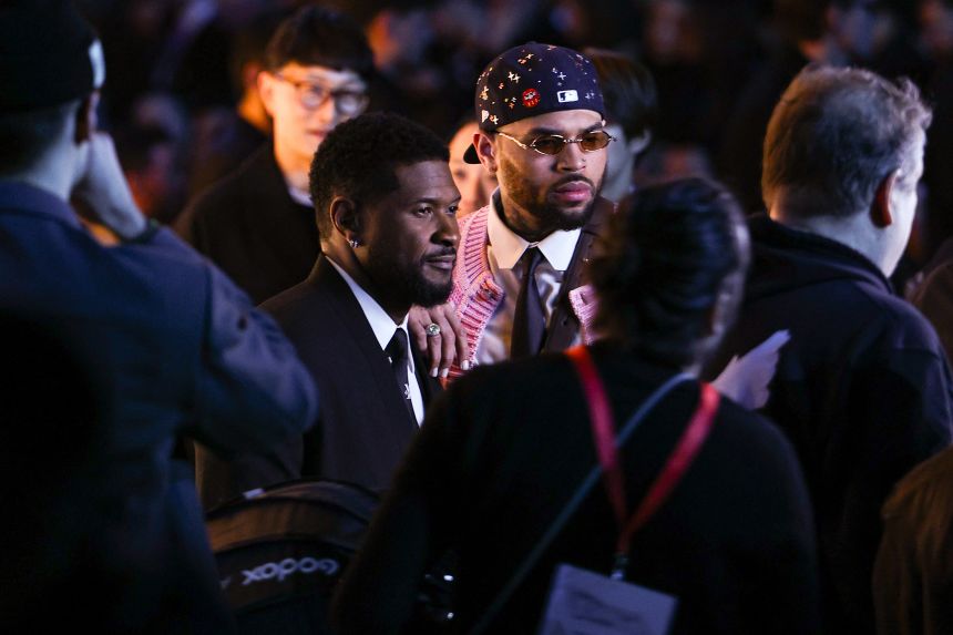 Usher and Brown attend the Louis Vuitton Menswear Fall/Winter 2026-2027 at Paris Fashion Week earlier this year, days before Brown was due in London for a court hearing.