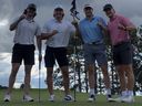 Toronto Maple Leafs winger Matthew Knies (second from left) celebrates after scoring a hole in one.