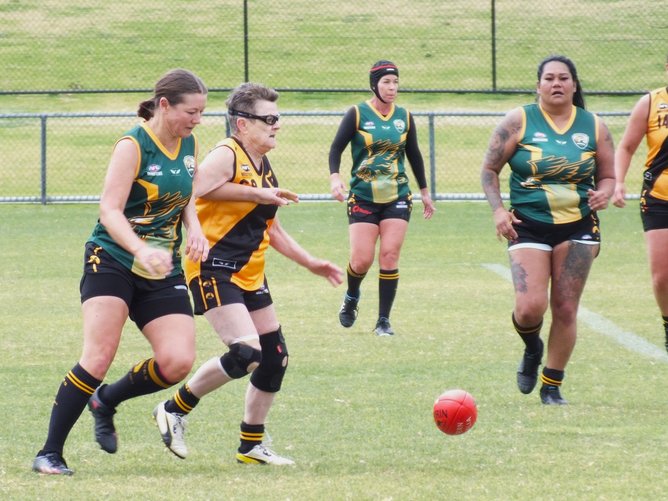 Pauline Gibb playing for the women's AFL Masters WA.