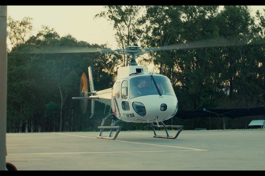 a helicopter takes off from a helipad