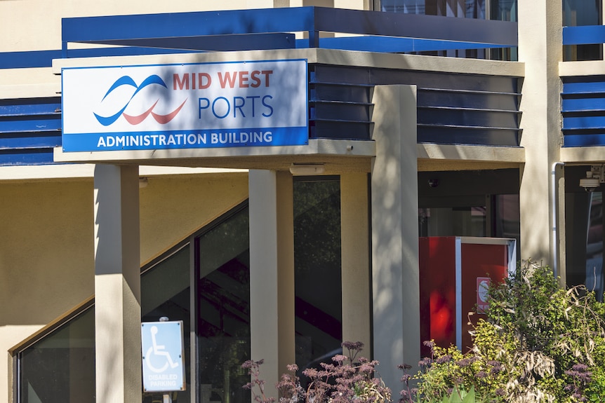 The outside building administration of Midwest Ports is a creamy colour with a Midwest Ports sign.