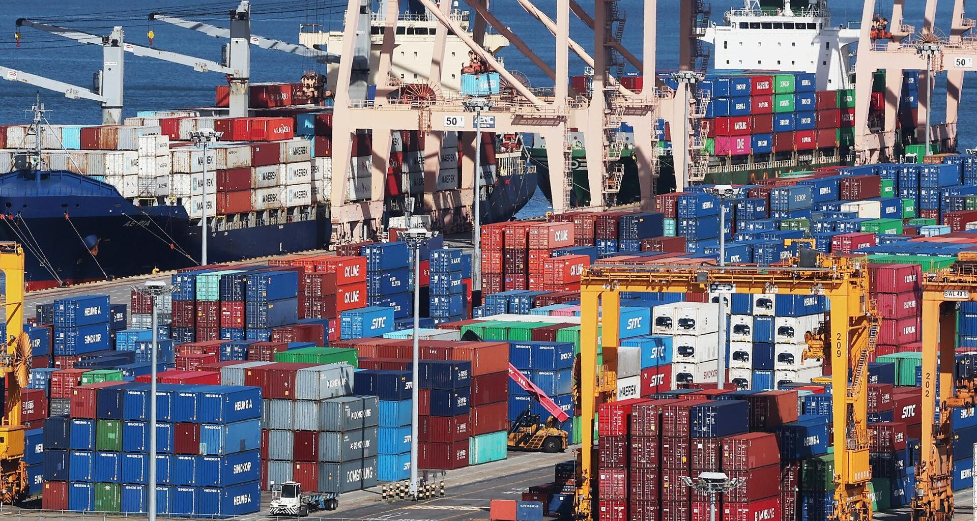 Containers are stacked at a port in Pyeongtaek, Gyeonggi Province, Sunday. Yonhap