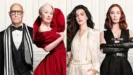 An official promotional image features the core cast of The Devil Wears Prada—Stanley Tucci, Meryl Streep, Anne Hathaway, and Emily Blunt—standing side-by-side in high-fashion black, red, and white outfits against a clean, paneled white background.