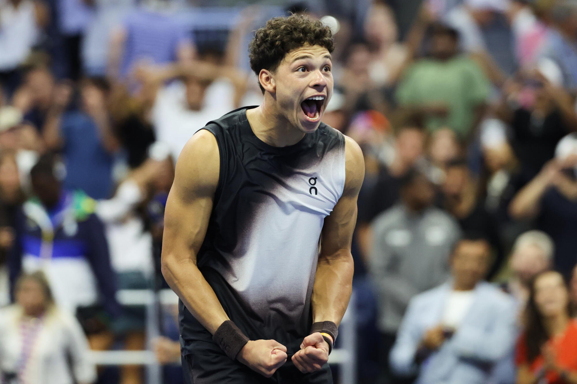 Ben Shelton celebrates after winning his marathon quarterfinal U.S. Open match against Carlos Alcaraz.