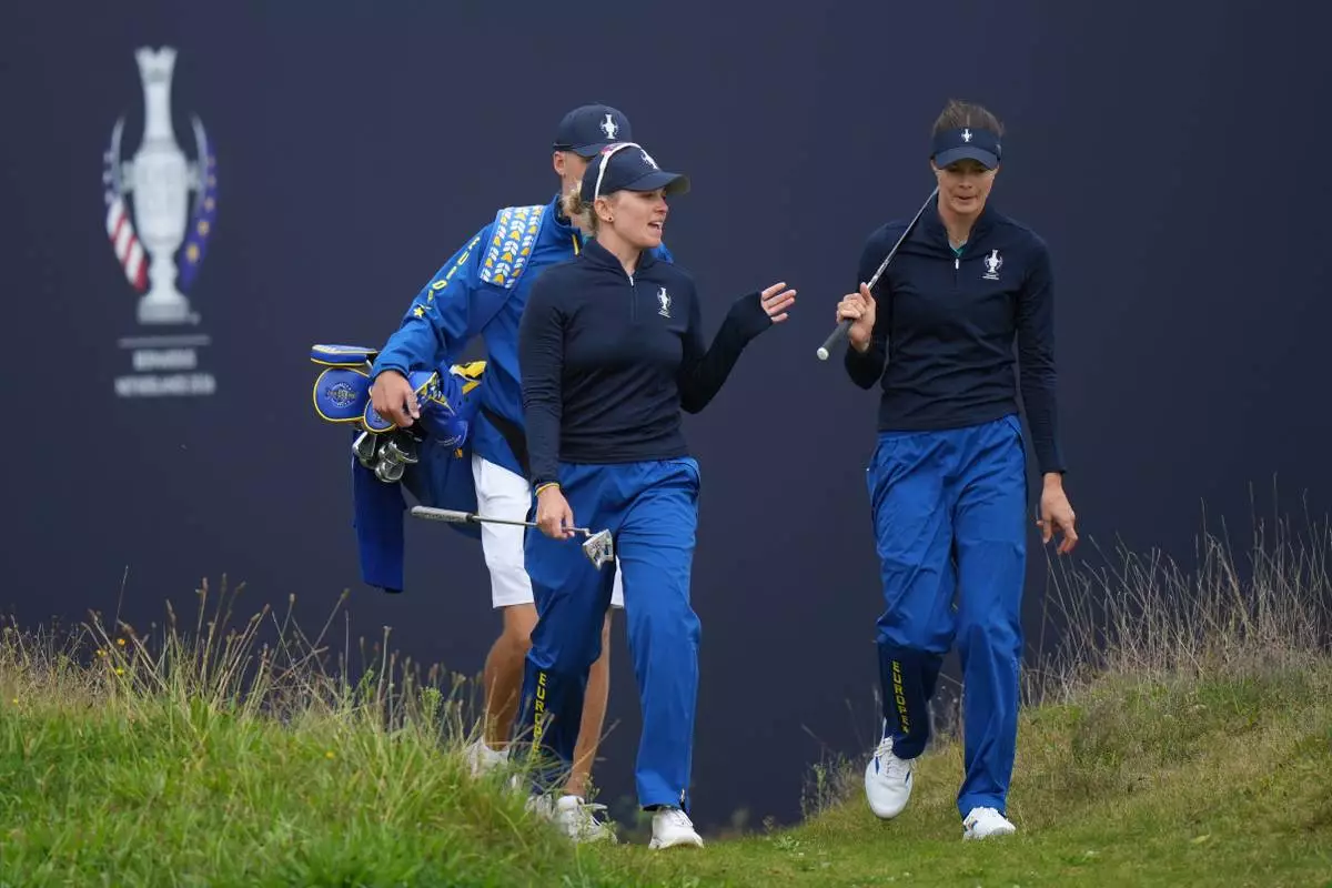Nanna Koerstz Madsen of Europe, left and Esther Henseleit of Europe walk onto the 15th green during a practice round for the Solheim Cup at the Bernardus Golf course in Vught, Netherlands, Wednesday, Sept. 9, 2026. (AP Photo/Alastair Grant)