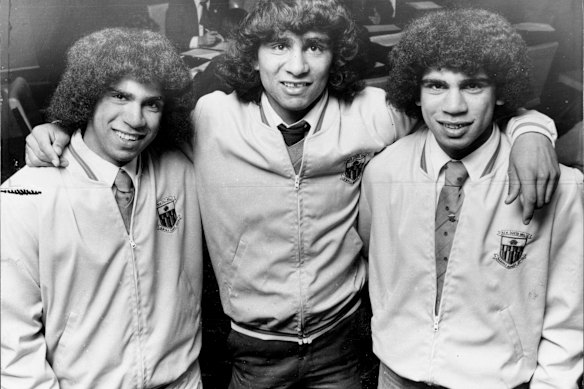 A teenage Mark Ella, right, with brothers Gary and Glen.