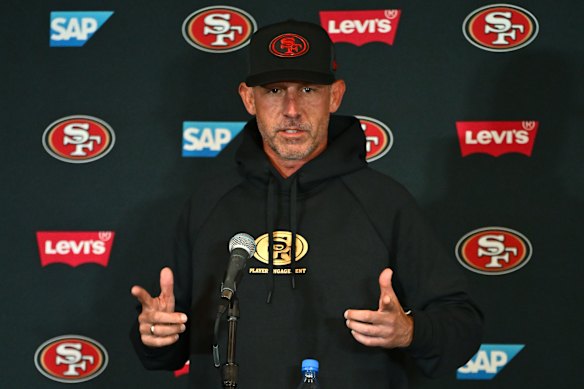Kyle Shanahan talks to the media.