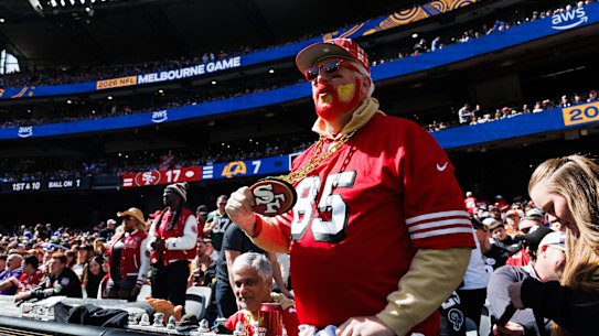 A 49ers fan watches the action at the MCG.