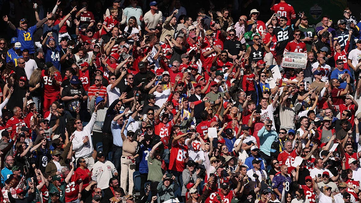 Fans show their support during an NFL game between the San Francisco 49ers and Los Angeles Rams at the Melbourne Cricket Ground.