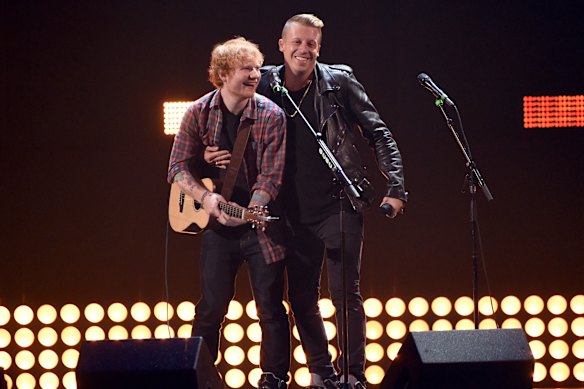 Ed Sheeran (left) claims it was not his decision to drop Macklemore (right) from the Loop tour.