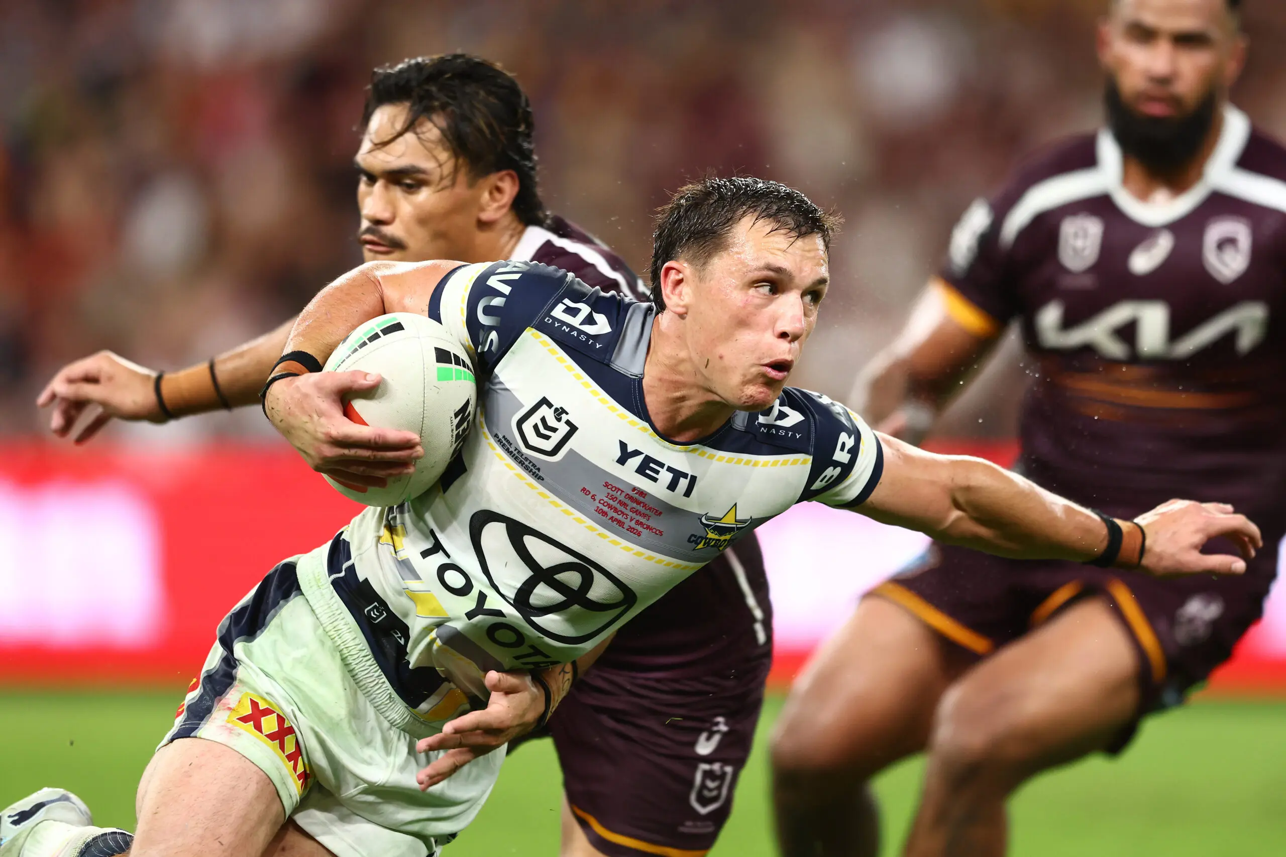 BRISBANE, AUSTRALIA - APRIL 10: Scott Drinkwater of the Cowboys is tackled during the round six NRL match between the Brisbane Broncos and North Queensland Cowboys at Suncorp Stadium on April 10, 2026 in Brisbane, Australia. (Photo by Chris Hyde/Getty Images)