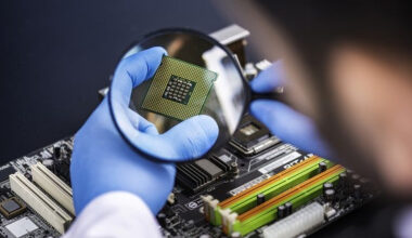 Magnifying glass on semiconductor chip.