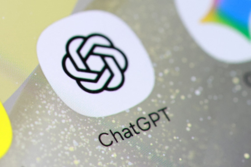 A white and black OpenAI Chat GPT mobile app logo on a dotted phone screen background.