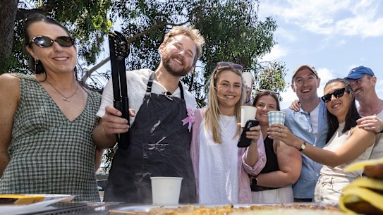 Noah and his friends enjoy a barbecue on the Yarra River on Sunday.