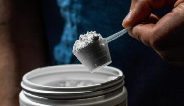 Man Scooping Sport Supplement Creatine Powder