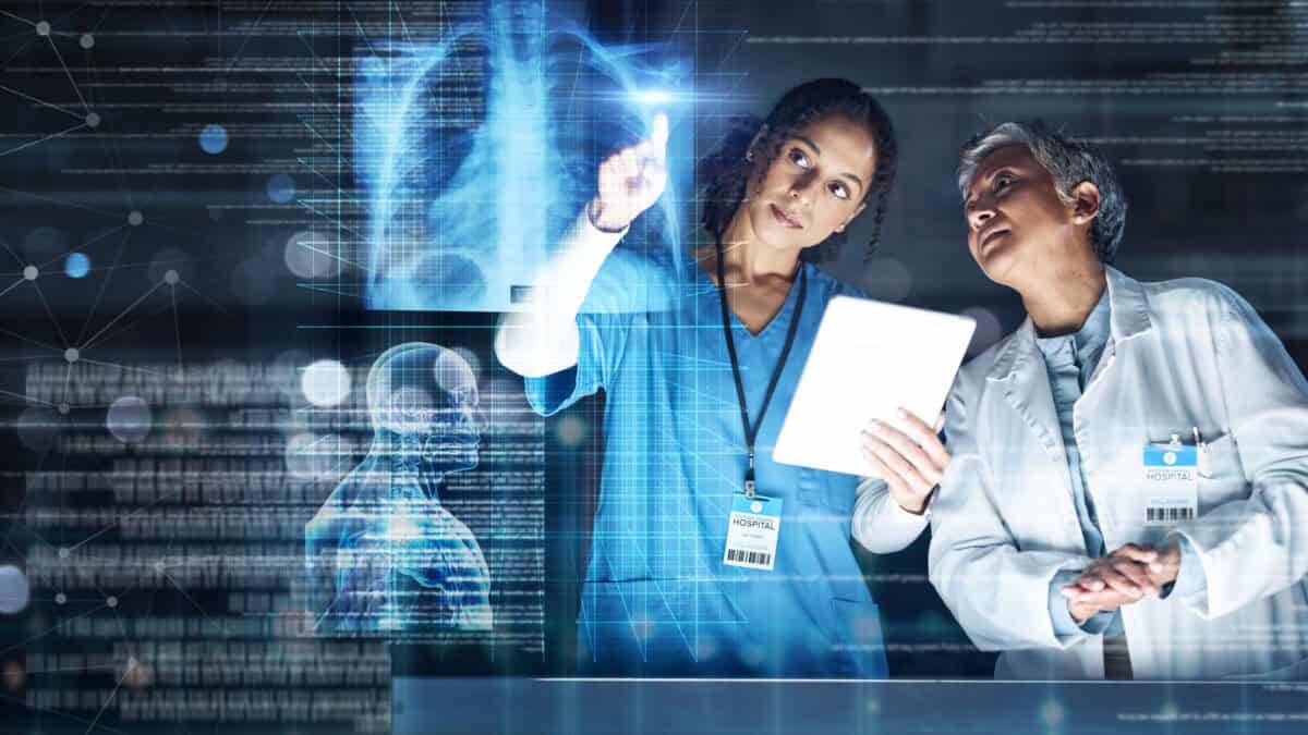 Medical workers examine an x-ray or scan in a hospital laboratory.