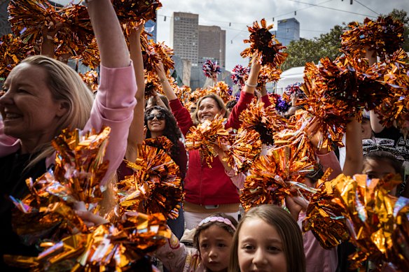 Staying cheerful: Fans at Federation Square on Sunday.