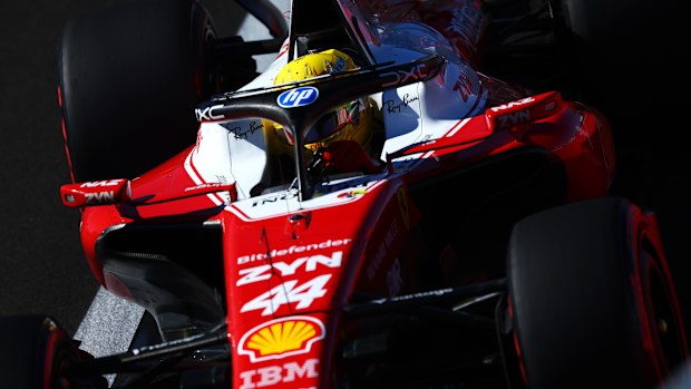 Hamilton sits in his car during qualifying.