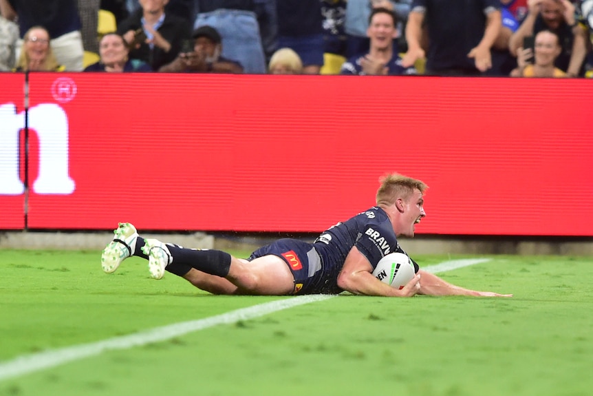 Tom Dearden Cowboys player crosses for a try in a NRL game