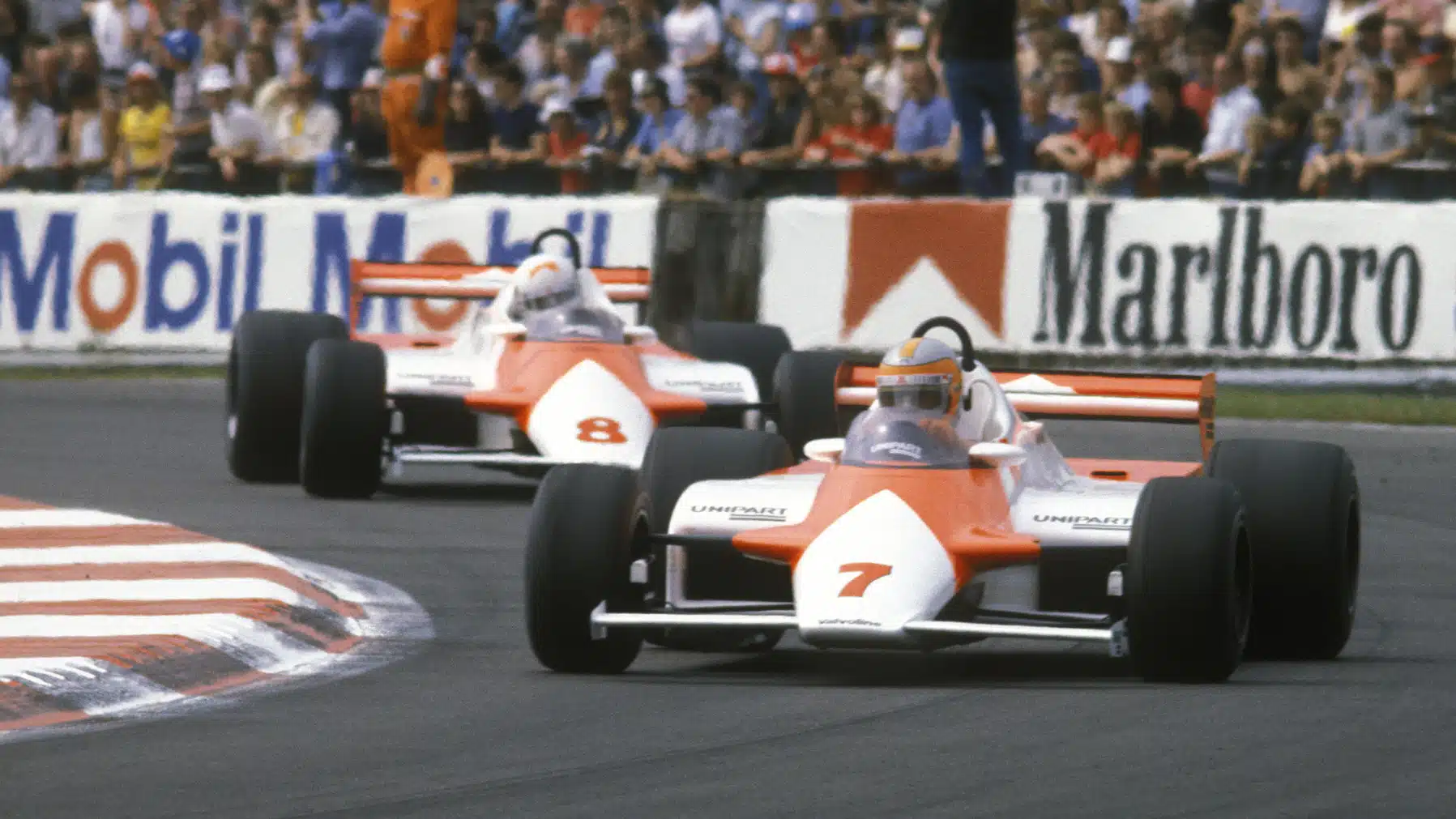 John Watson leads McLaren-Mercedes team-mate Andrea de Cesaris in the 1981 British Grand Prix