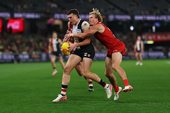 Rowan Marshall of the Saints and Jed Walter of the Suns compete for the ball.