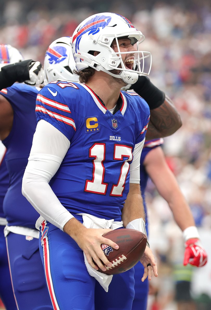 Josh Allen #17 of the Buffalo Bills celebrates after scoring a touchdown.