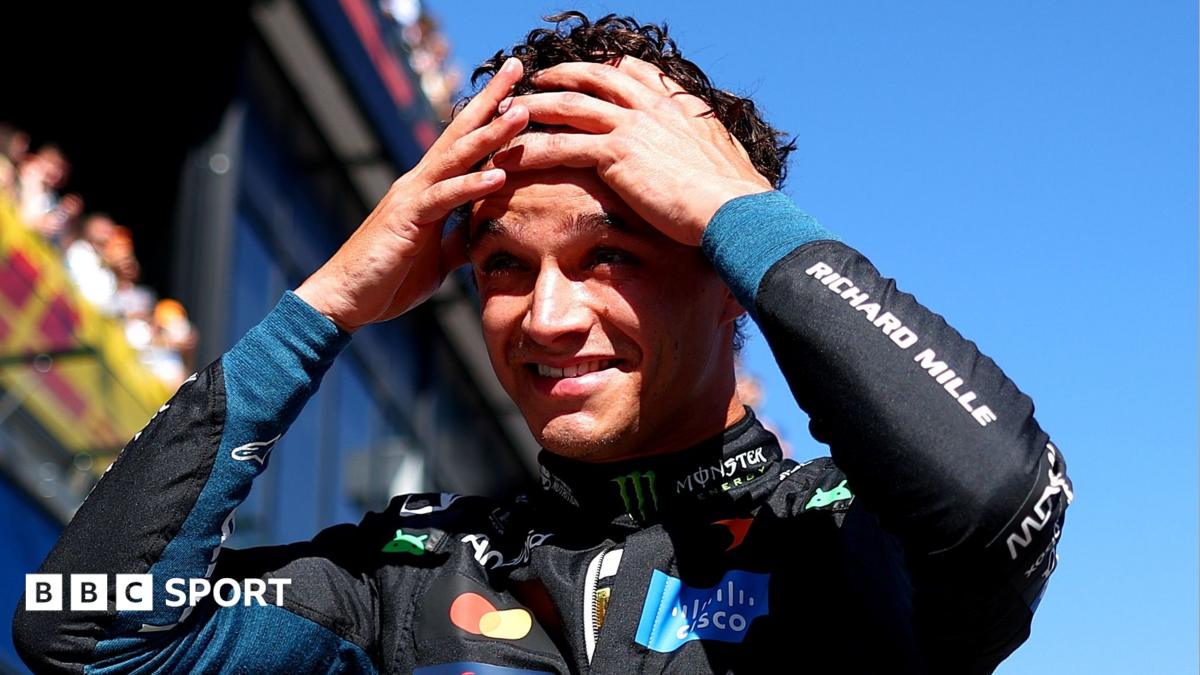 Lando Norris has both hands on his head and appears shocked after taking pole position for the Spanish Grand Prix