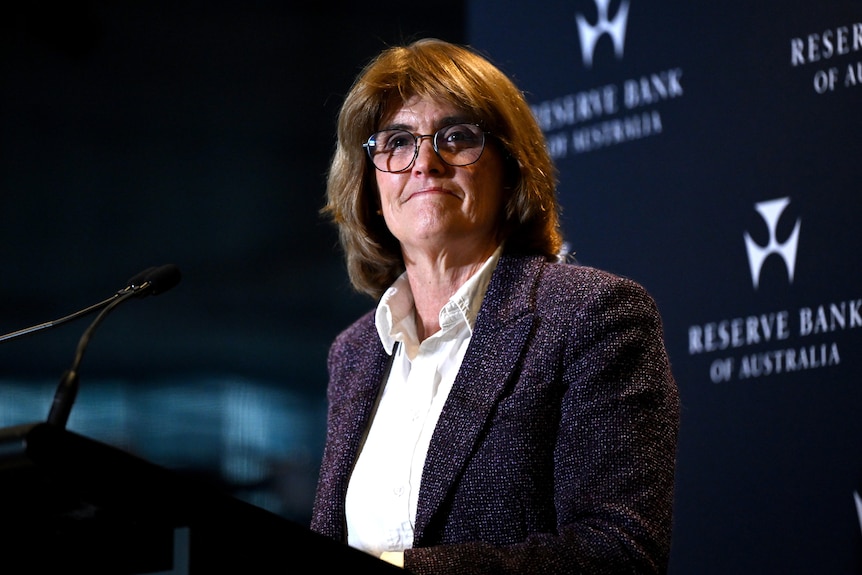 Michele Bullock at lectern, smiling