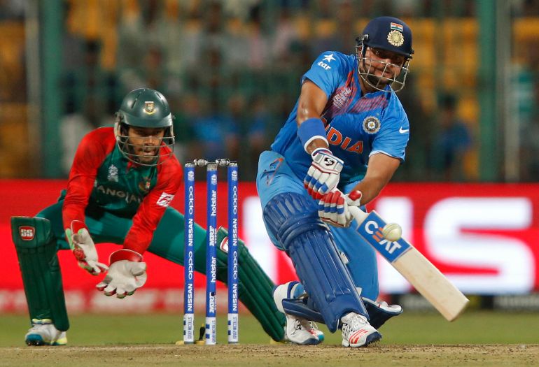 Indian cricketer, seen here batting in the blue uniform, was questioned by law enforcement agencies over endorsements for online betting companies [FILE: Danish Siddiqui/ Reuters]