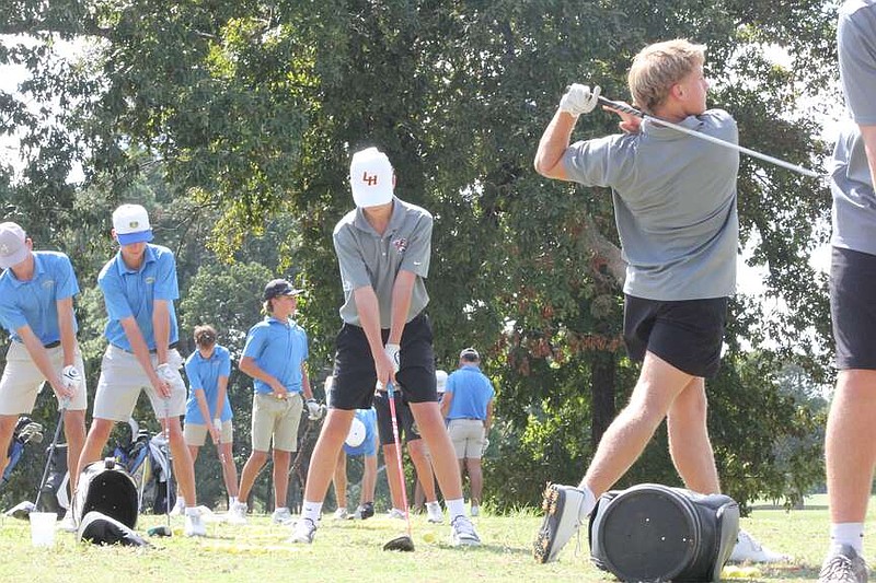 Lakeside and Lake Hamilton golfers warm up prior to Thursday's three-team golf meet at Hot Springs Country Club. (The Sentinel-Record/Pat Geans)
