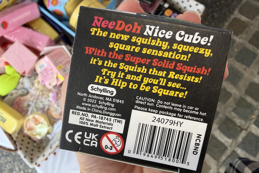 The back of a NeeDoh Nice Cube box showing ingredients listed as 100% malt extract.