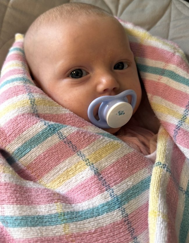 The couple have four of the hospital blankets and only three kids.