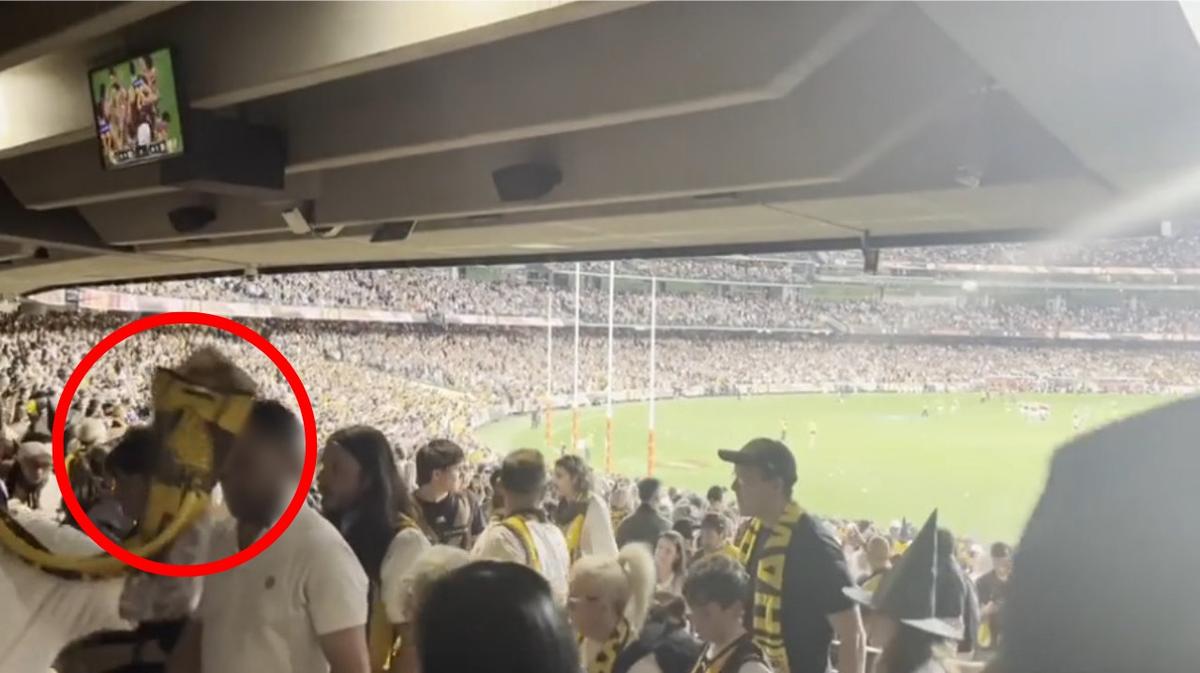 Police set to lay assault charges after nachos thrown at young family at Brisbane-Hawthorn MCG thriller