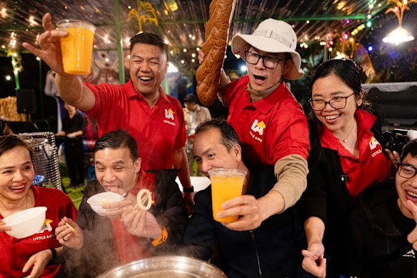 Anthony Nguyen and Henry Nguyen (standing) are two of the organisers behind the booming outdoor space in Canley Vale attached to Lang An restaurant.