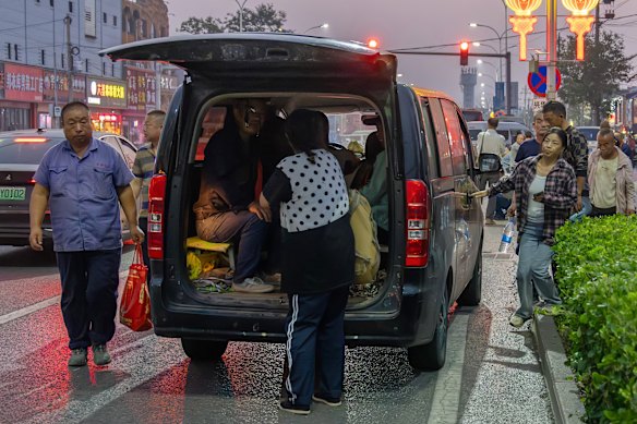 Migrant workers who have secured jobs for the day are picked up by their employer.